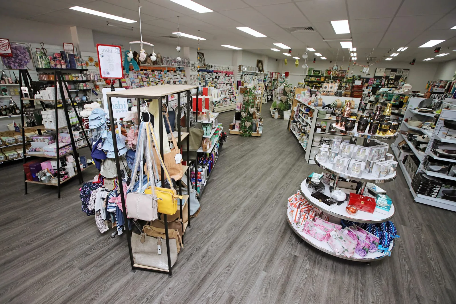 Half of the interior of our recently expanded store. Here you can see our range of apparel, homewares, and gift cards.